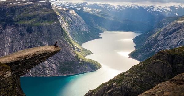 aerial view of Trolltunga in Norway - cliff edge rock overlooking a river - three week traveller